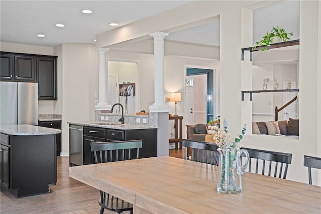 3035 Brookstone Dr, Cecil, PA 15317 - dining room featuring decorative columns, wood finished floors, and recessed lighting