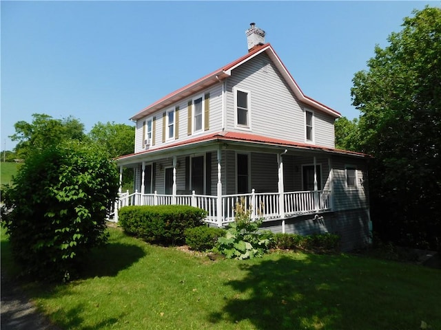 309 Mooney Ridge Rd, Waynsbrg/Frankln Twp, PA 15370 - rear view of property featuring a porch, a lawn, and a chimney