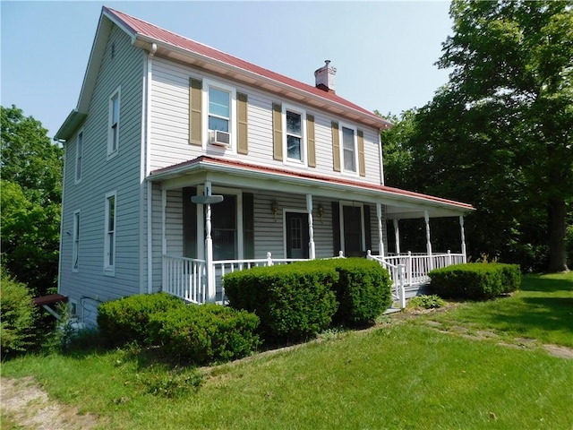 309 Mooney Ridge Rd, Waynsbrg/Frankln Twp, PA 15370 - view of front facade with a porch, a chimney, a front lawn, metal roof, and cooling unit