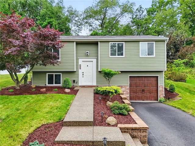 450 Limestone Dr, Bethel Park, PA 15102 - split foyer home featuring a garage, a front lawn, driveway, and brick siding