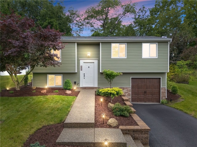 450 Limestone Dr, Bethel Park, PA 15102 - raised ranch with an attached garage, a lawn, and driveway