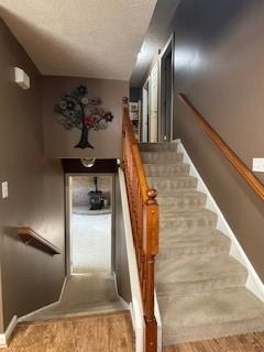 142 Poorbaugh Rd, Bullskin Twp, PA 15425 - stairway with wood finished floors and baseboards
