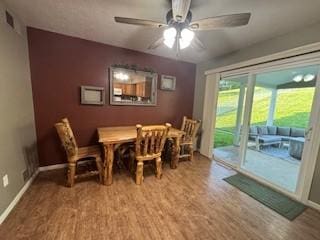 142 Poorbaugh Rd, Bullskin Twp, PA 15425 - dining space featuring wood finished floors, a ceiling fan, and baseboards