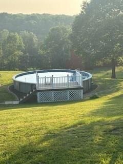 142 Poorbaugh Rd, Bullskin Twp, PA 15425 - back of property with a lawn and a deck