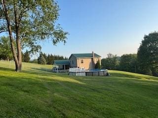 142 Poorbaugh Rd, Bullskin Twp, PA 15425 - view of grassy yard with an outdoor pool