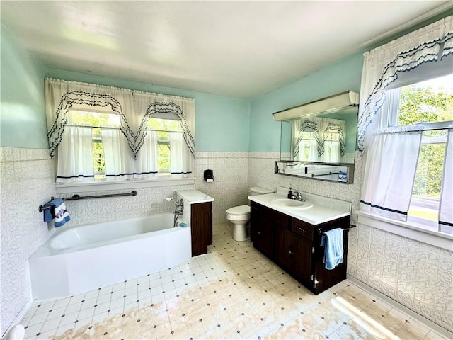 4404 Hollow Rd, Shenango Twp Law, PA 16101 - full bath with tile walls, vanity, a garden tub, toilet, and wainscoting