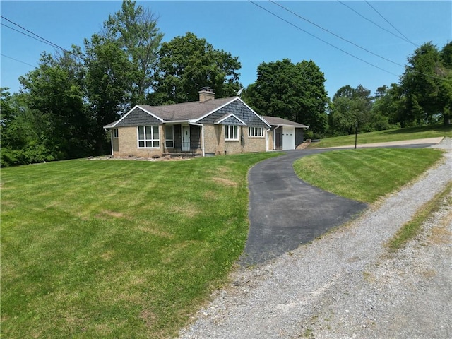 721 Herman Rd, Summit Twp But, PA 16002 - single story home featuring brick siding, a chimney, asphalt driveway, and a front yard