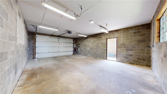 721 Herman Rd, Summit Twp But, PA 16002 - garage featuring concrete block wall and a garage door opener