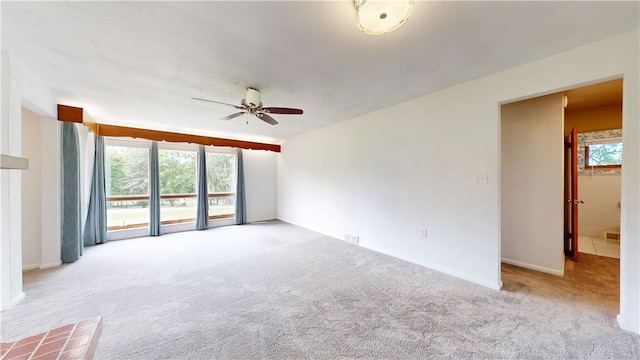 721 Herman Rd, Summit Twp But, PA 16002 - unfurnished living room with ceiling fan, light colored carpet, and healthy amount of natural light