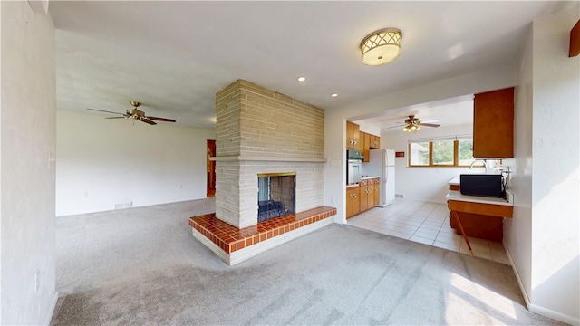 721 Herman Rd, Summit Twp But, PA 16002 - unfurnished living room featuring a ceiling fan, light carpet, a fireplace, and light tile patterned floors