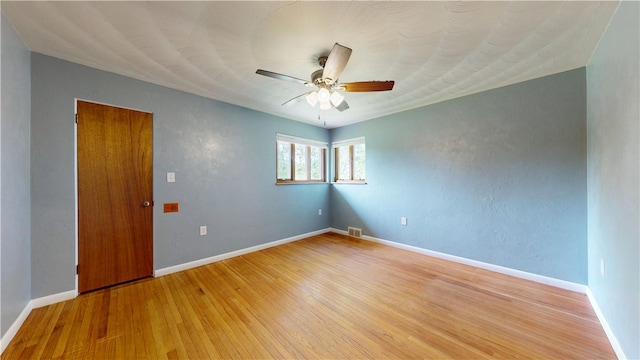 721 Herman Rd, Summit Twp But, PA 16002 - empty room with light wood-style floors, a ceiling fan, and baseboards