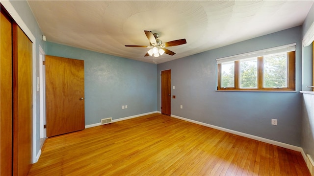 721 Herman Rd, Summit Twp But, PA 16002 - unfurnished bedroom featuring light wood finished floors, baseboards, a ceiling fan, and a closet