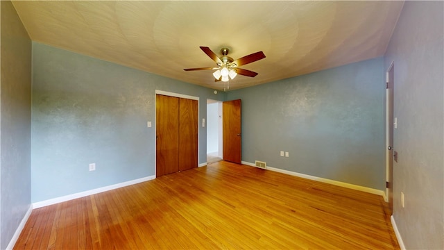 721 Herman Rd, Summit Twp But, PA 16002 - unfurnished bedroom featuring wood finished floors, a closet, baseboards, and a ceiling fan