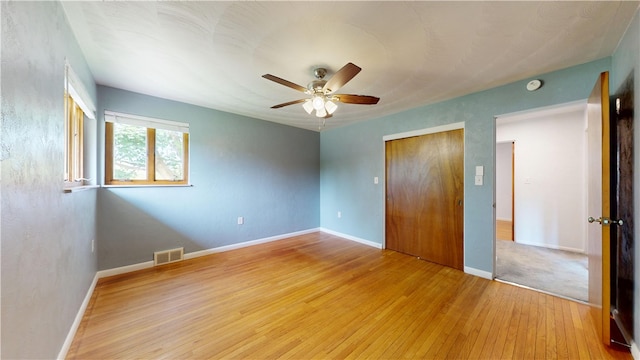 721 Herman Rd, Summit Twp But, PA 16002 - unfurnished bedroom featuring light wood-style floors, a closet, baseboards, and ceiling fan