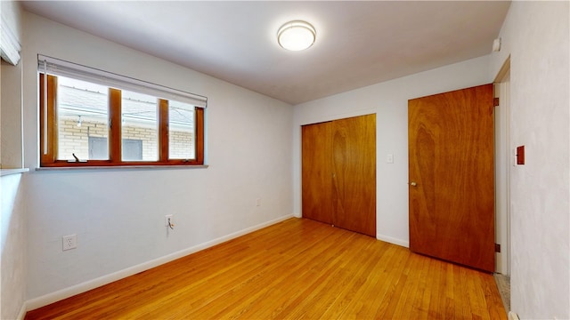 721 Herman Rd, Summit Twp But, PA 16002 - unfurnished bedroom featuring light wood-style flooring, baseboards, and a closet