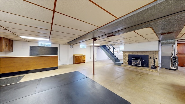 721 Herman Rd, Summit Twp But, PA 16002 - below grade area featuring a drop ceiling, a fireplace, stairs, and heating unit