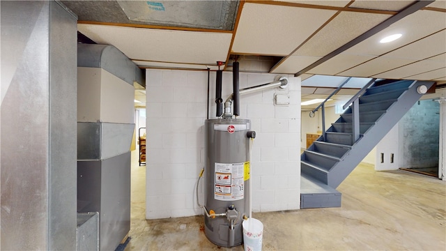 721 Herman Rd, Summit Twp But, PA 16002 - below grade area featuring gas water heater, stairs, and concrete block wall