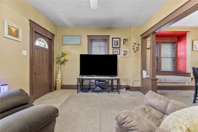 800 Romine Ave, Port Vue, PA 15133 - living area with ornate columns, carpet, baseboards, and ceiling fan