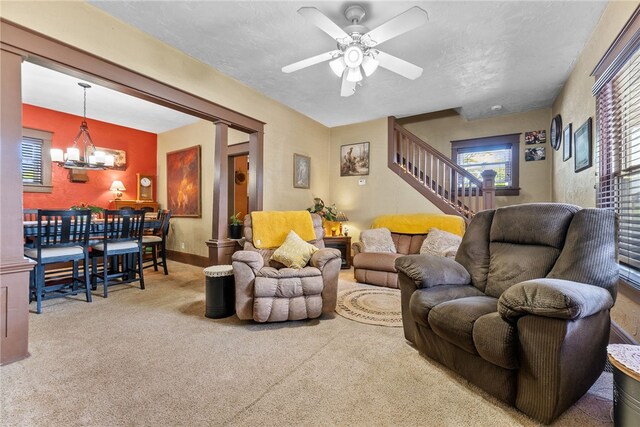 800 Romine Ave, Port Vue, PA 15133 - carpeted living area featuring stairs, a ceiling fan, a chandelier, and plenty of natural light