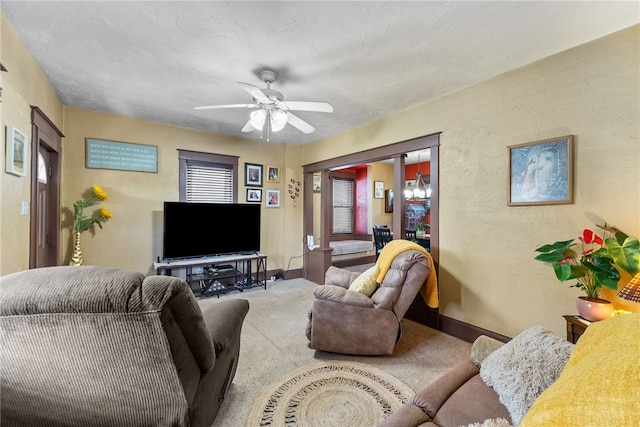 800 Romine Ave, Port Vue, PA 15133 - living room with carpet, baseboards, a textured wall, and ceiling fan