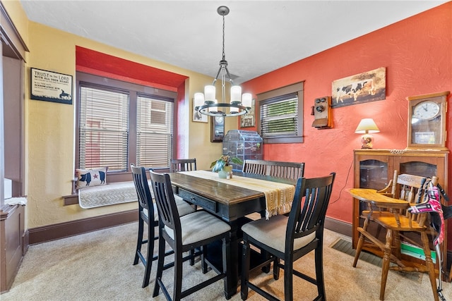 800 Romine Ave, Port Vue, PA 15133 - carpeted dining area featuring a textured wall, a chandelier, and baseboards