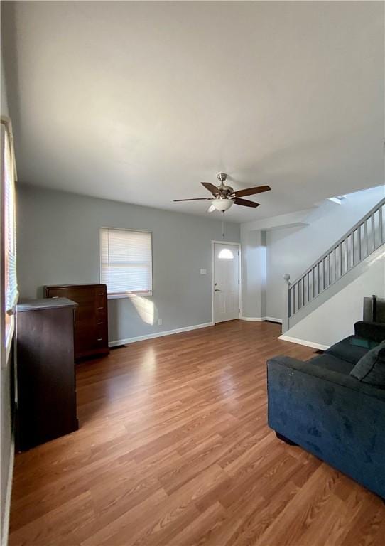 923 Fentzel, Tarentum, PA 15084 - living room featuring ceiling fan, wood finished floors, stairs, and baseboards