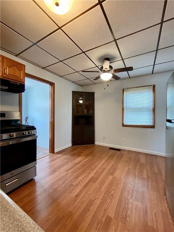923 Fentzel, Tarentum, PA 15084 - kitchen featuring stainless steel gas stove, a paneled ceiling, under cabinet range hood, light wood finished floors, and ceiling fan