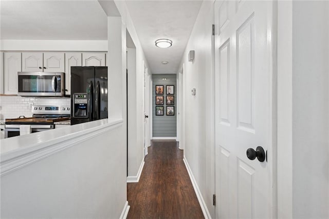 1703 Barry Dr, North Huntingdon, PA 15642 - hallway featuring dark wood-style floors and baseboards