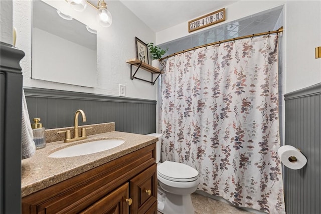 1703 Barry Dr, North Huntingdon, PA 15642 - full bath with a wainscoted wall, vanity, toilet, and curtained shower