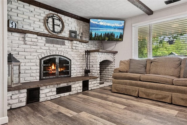 1703 Barry Dr, North Huntingdon, PA 15642 - living room with a fireplace, wood finished floors, and beam ceiling