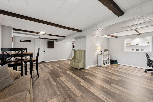 1703 Barry Dr, North Huntingdon, PA 15642 - living area with beam ceiling, wood finished floors, and baseboards