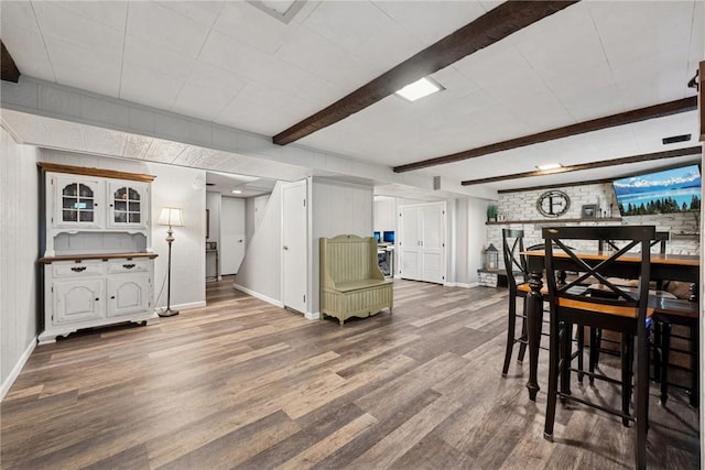 1703 Barry Dr, North Huntingdon, PA 15642 - dining area featuring baseboards, wood finished floors, and beamed ceiling