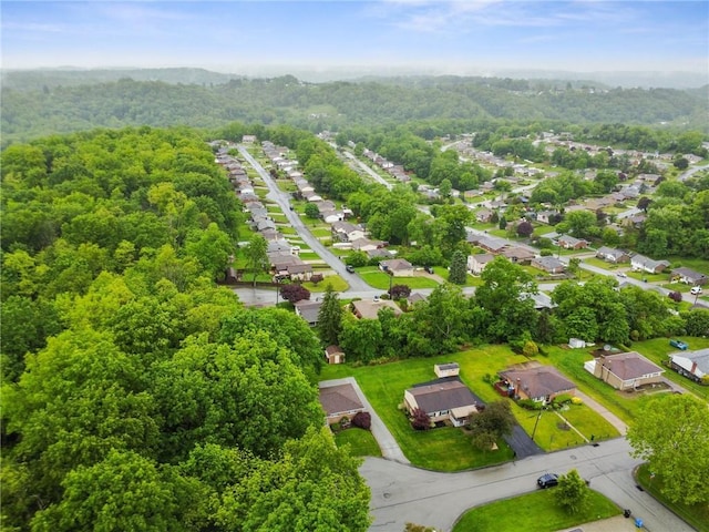 1703 Barry Dr, North Huntingdon, PA 15642 - aerial perspective of suburban area with a heavily wooded area