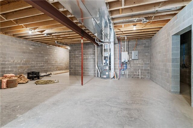 480 Matty, Rostraver, PA 15012 - unfinished below grade area featuring electric panel, heating unit, and tankless water heater