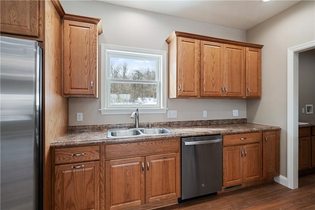 480 Matty, Rostraver, PA 15012 - kitchen with stainless steel appliances, a sink, and brown cabinetry