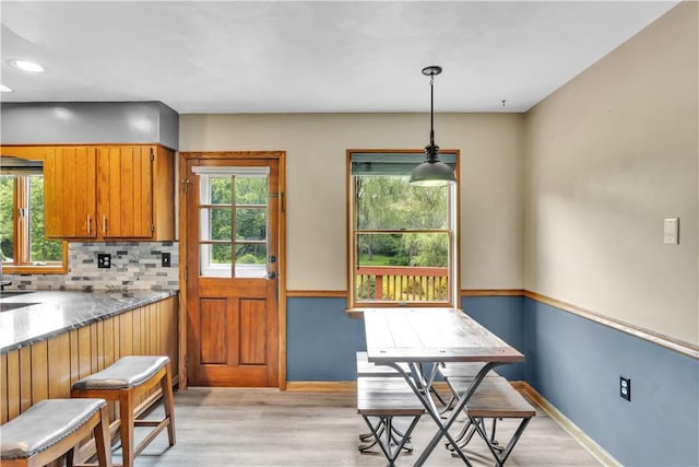 206 Brook Hollow Rd, Pa, PA 15666 - kitchen with healthy amount of natural light, light wood-type flooring, brown cabinets, and recessed lighting