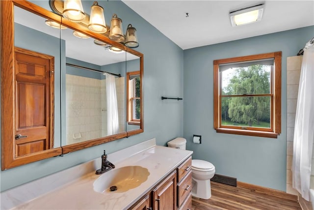 206 Brook Hollow Rd, Pa, PA 15666 - bathroom with vanity, toilet, wood finished floors, and a shower with curtain