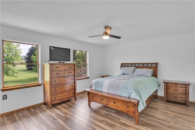 206 Brook Hollow Rd, Pa, PA 15666 - bedroom featuring multiple windows, light wood-style floors, baseboards, and a ceiling fan