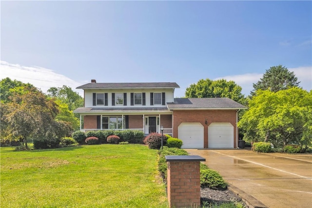 206 Brook Hollow Rd, Pa, PA 15666 - traditional home with an attached garage, concrete driveway, a front lawn, brick siding, and a chimney