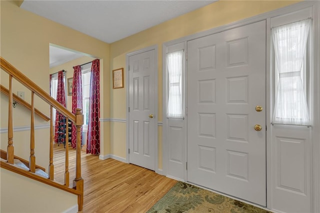 117 Bayberry Ln, Cranberry Twp, PA 16066 - foyer entrance with light wood-type flooring, stairs, and baseboards