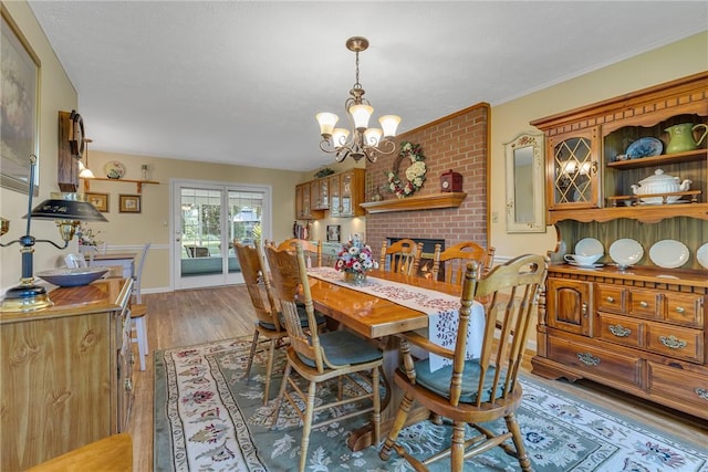 117 Bayberry Ln, Cranberry Twp, PA 16066 - dining space featuring a chandelier, light wood finished floors, and baseboards