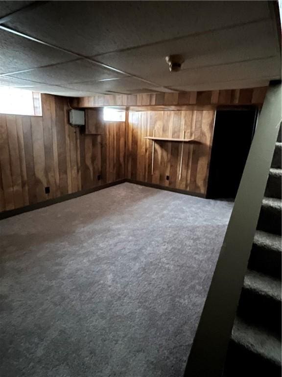 10807 Highpoint Dr, Penn Hills, PA 15235 - below grade area with carpet flooring, stairs, and wooden walls