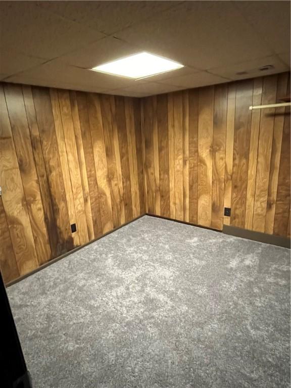 10807 Highpoint Dr, Penn Hills, PA 15235 - finished basement with carpet flooring, wood walls, and a drop ceiling