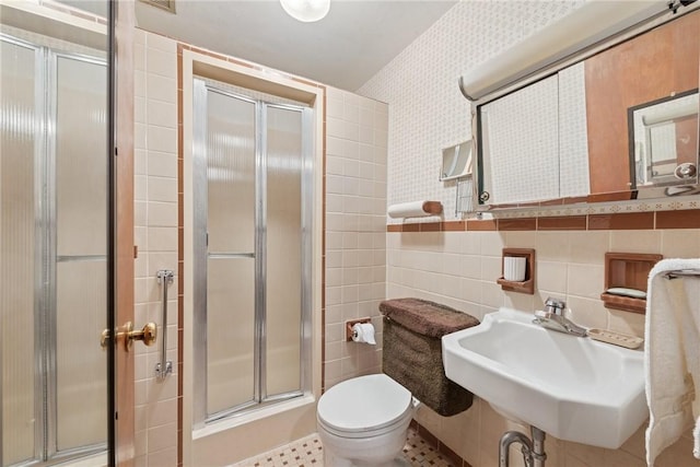 1341 Foxboro Dr, Monroeville, PA 15146 - bathroom featuring a shower stall, tile walls, toilet, and a sink