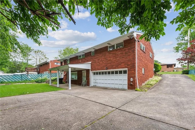 1341 Foxboro Dr, Monroeville, PA 15146 - view of front of house featuring a garage, concrete driveway, and brick siding