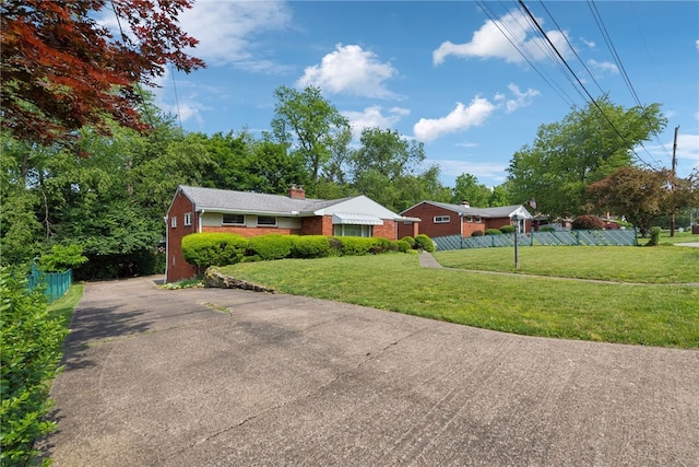 1341 Foxboro Dr, Monroeville, PA 15146 - ranch-style house featuring brick siding, a chimney, and driveway