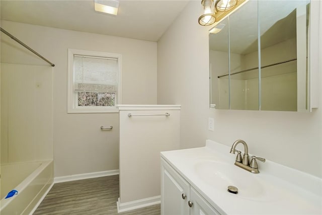 2596 Tilbrook Rd, Monroeville, PA 15146 - full bathroom featuring wood finished floors, vanity, baseboards, and bathing tub / shower combination