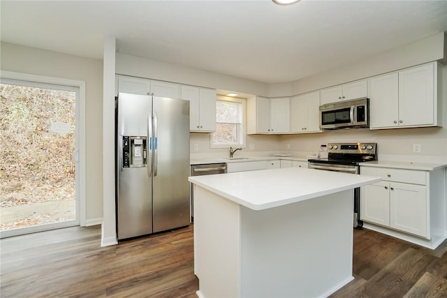 2596 Tilbrook Rd, Monroeville, PA 15146 - kitchen featuring appliances with stainless steel finishes, a sink, dark wood-style flooring, white cabinetry, and light countertops