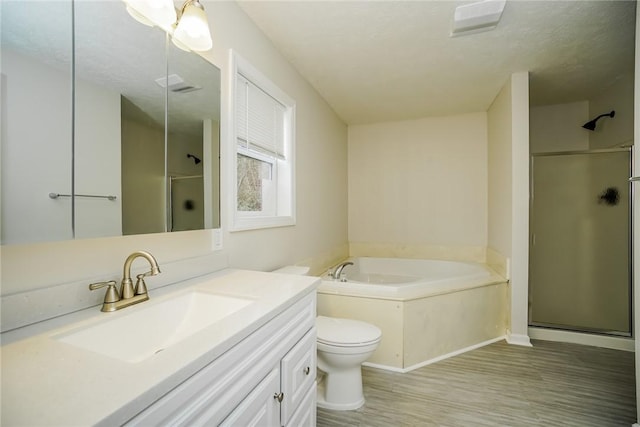 2596 Tilbrook Rd, Monroeville, PA 15146 - bathroom with a shower stall, vanity, a bath, wood finished floors, and toilet