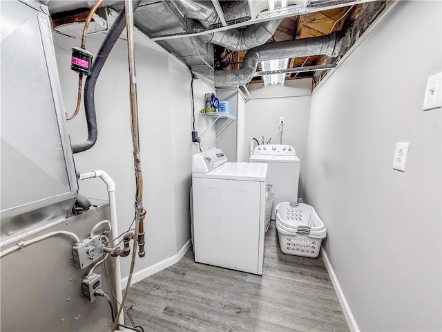 2787 Queensboro Ave, Baldwin Twp, PA 15226 - washroom featuring washer and dryer, wood finished floors, baseboards, and heating unit